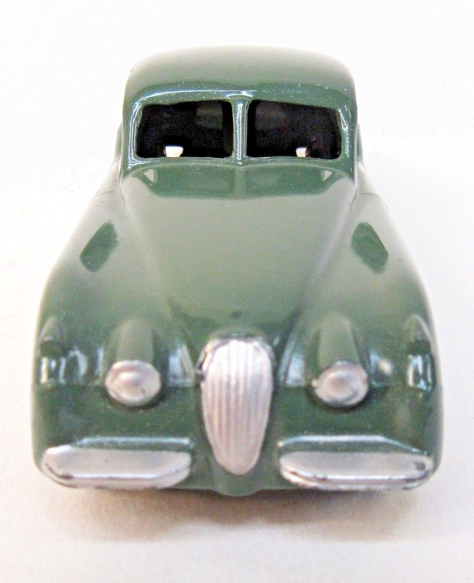 1950's Dinky #157 JAGUAR XK-120 dark green w/ cream hubs