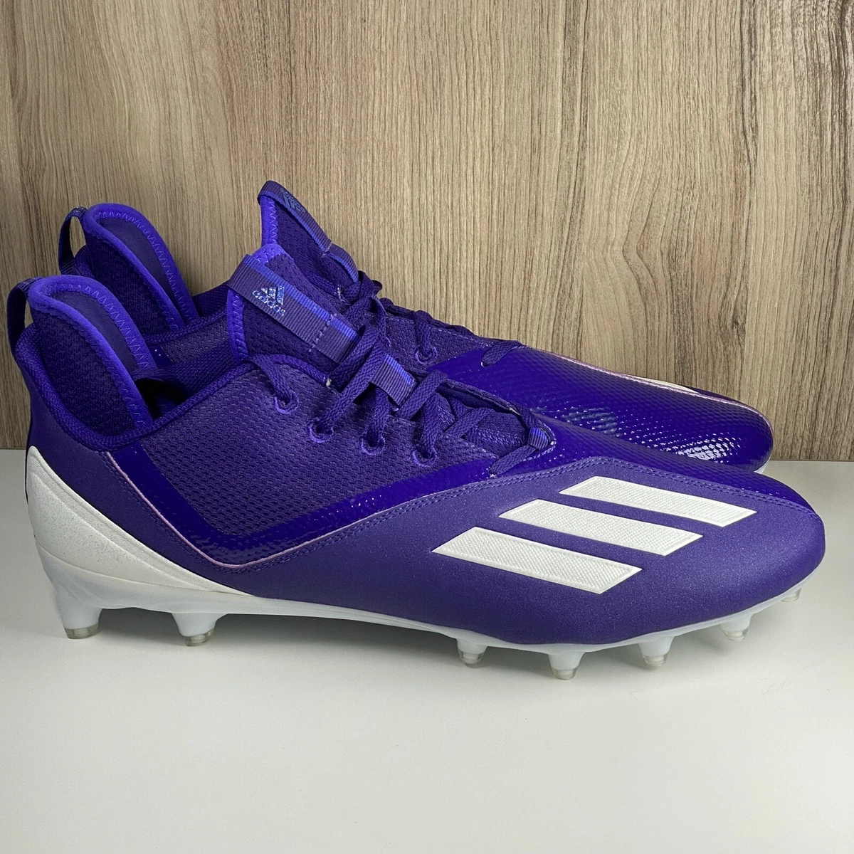 purple and white football cleats