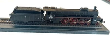 HO model express  steam locomotive with tender, plus display case.