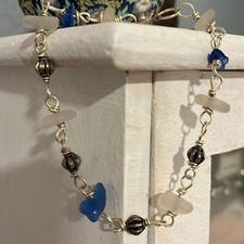 Pretty silver sea glass bracelet. 9 real glass pieces on silver. Easy clasp