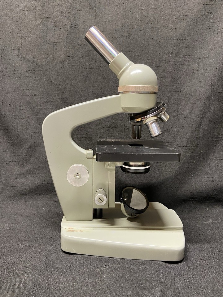 A beautifully aged Tasco compound microscope from Japan that looks incredible as a decorative sci-fi prop or shelf centerpiece, even if you never peer through the eyepiece.