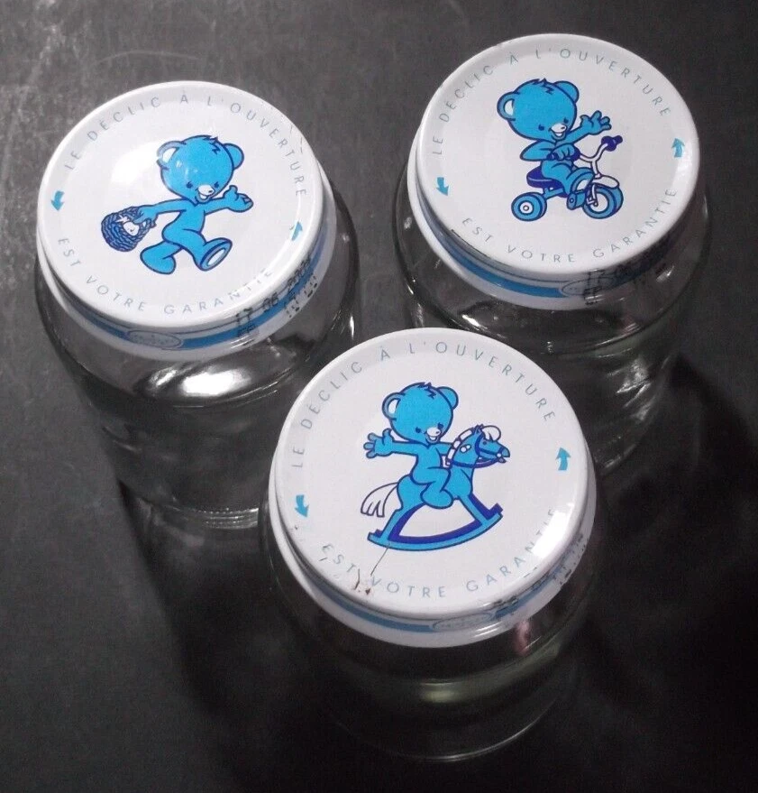 3 x Nestle Empty Glass Jar, 3 different metal Lid writes Le déclic à l'ouverture
