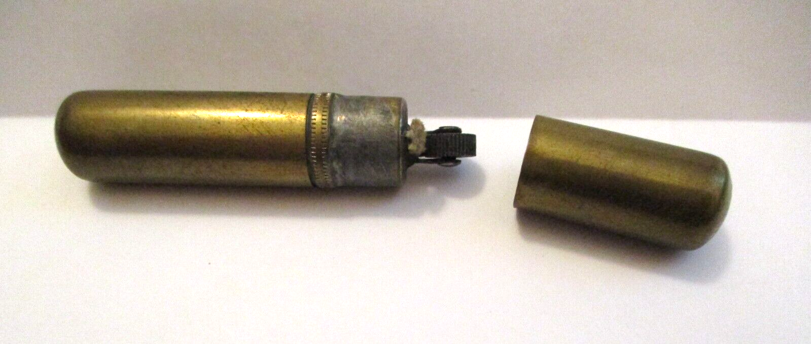 OLD VINTAGE BRASS TUBE COLLECTIBLE CIGARETTE LIGHTER WE SELL LIGHTERS