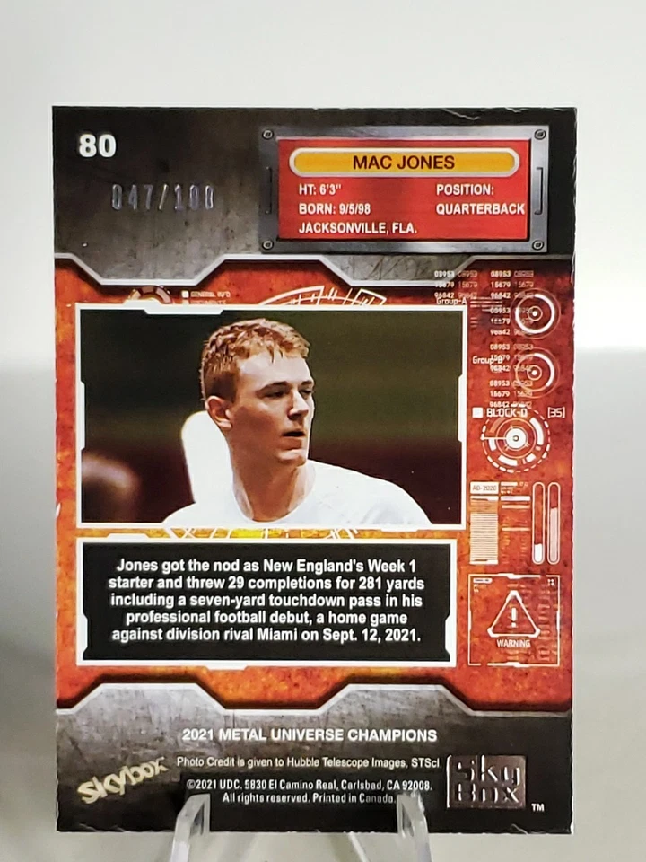 2021 Skybox Metal Universe Champions PMG Orange /100 Mac Jones Rookie RC - Image 2 of 3