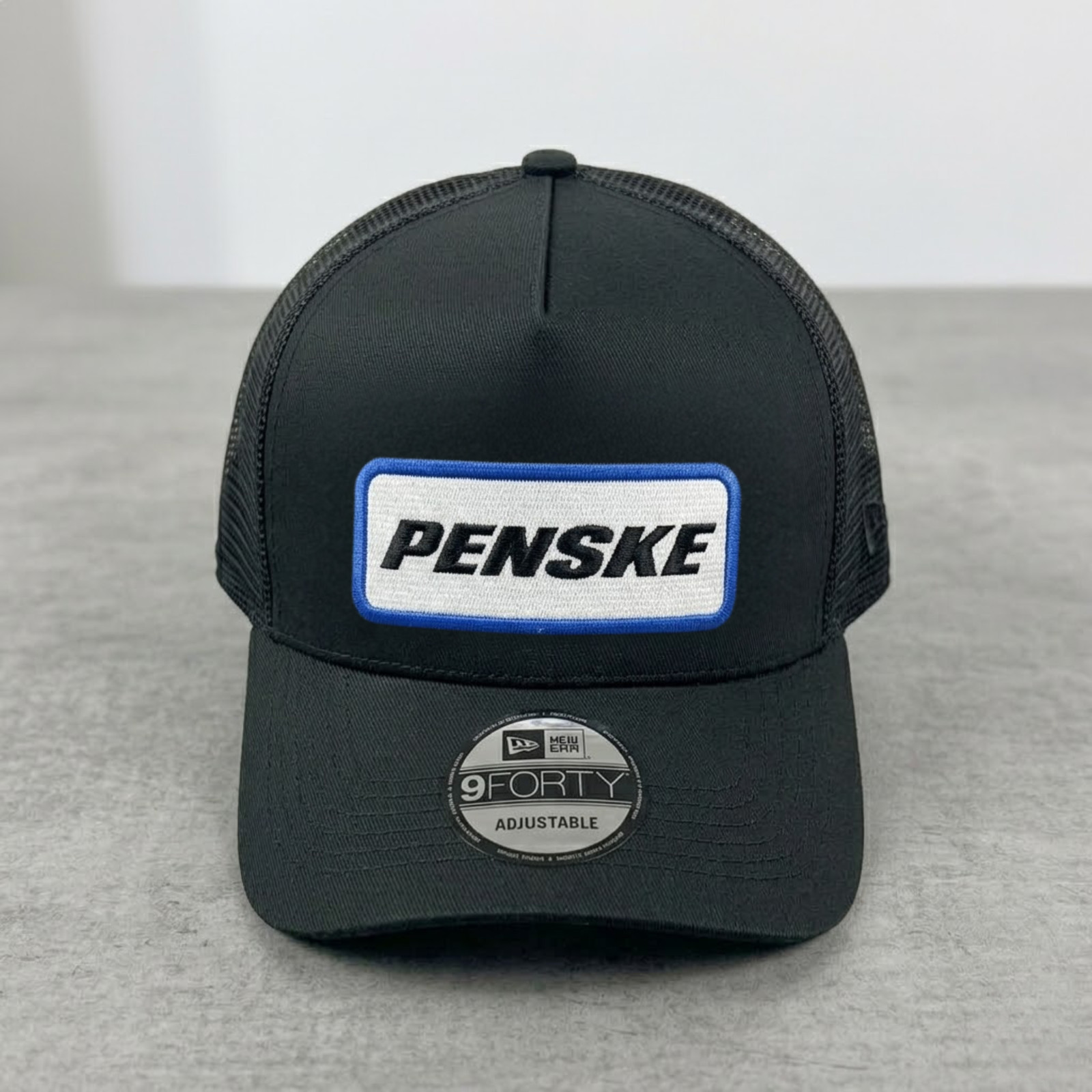 Penske Logo Embroidered Black Trucker Hat Black Mesh Snapback Cap