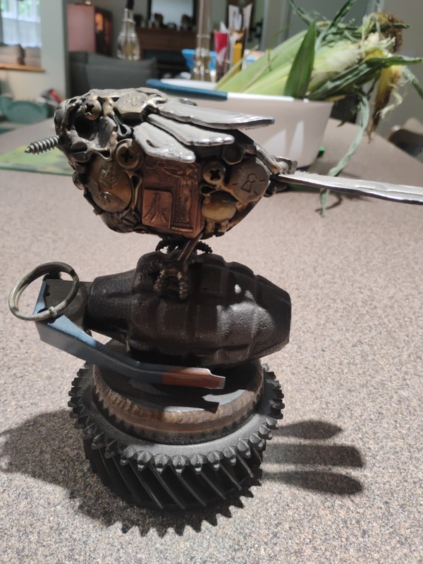 Gears Of War Bird ? Holding grenade Sitting On Gear