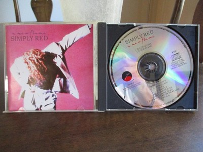 SIMPLY RED - A NEW FLAME - Reissue EastWest Records CD Near Mint $1.95