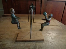 GIBBS CHILDREN ON A SEE SAW TEETER TOTTER KIDS SWING TIN TOY 1900s