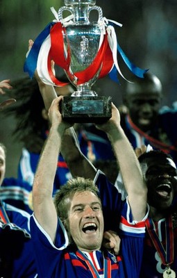 Didier Deschamps of France lifts the trophy after their victory in- Old Photo
