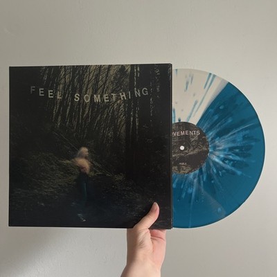 Feel something by movements 12  coloured vinyl record half blue/white w splatter