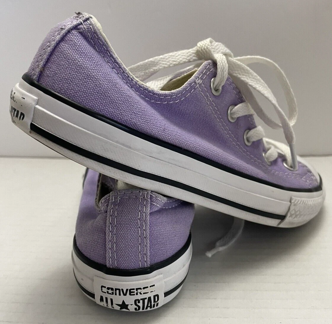 Purple converse shop girl