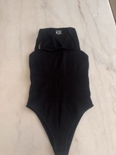 OQQ Women's Black Ribbed Stretch Bodysuit Size S Strap Button Accents