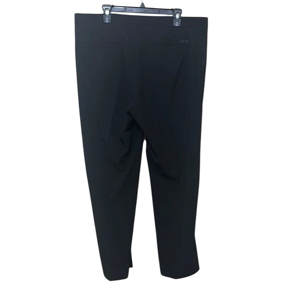 Pantalones de vestir IZOD Golf sofisticados negros cónicos Foto 2 de 4