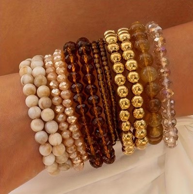 12er Set ausgefallene Armbänder aus goldenen, bernsteinfarbenen und marmorierten Perlen