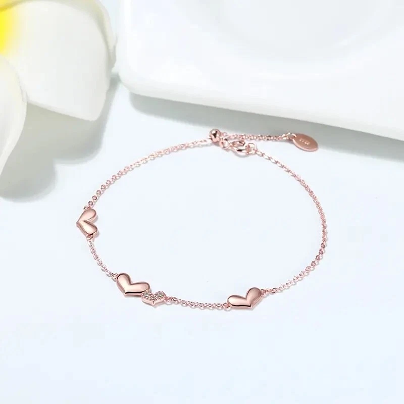 Pulsera de cuatro corazones de oro rosa 925 con acento de circonita - ajustable Foto 3 de 4