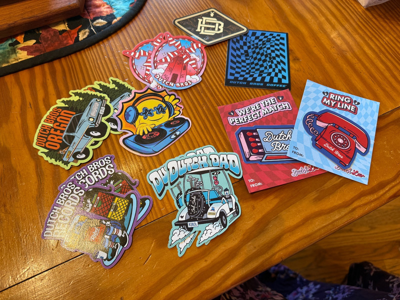 Set of 13 Dutch Bros items: 11 stickers, 2 magnets - NEW