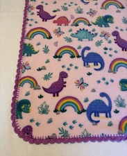 Fleece Baby Girl Blanket With Crochet Trim - Dinosaurs on Pink Background