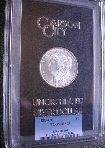 1883-CC PCGS MS65 MORGAN DOLLAR IN GSA HOLDER.