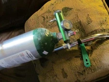 Empty E size used medical oxygen tank with cart  regulator and key pickup only