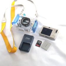 Canon PowerShot SD1000 Digital ELPH Camera W/ Battery Charger SD Waterproof Case