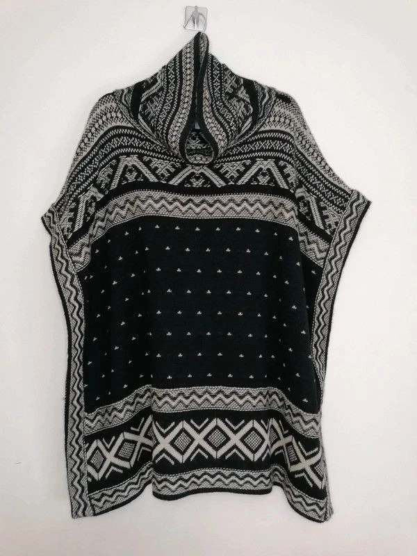 Monsoon Black Knit Poncho size S/M
Opens in a new window or tab
