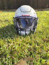 Medium White Riddell Speedflex, with sports star chinstrap 