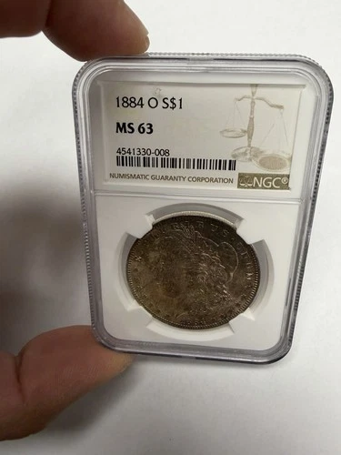 1884 O Morgan Silver Dollar $1 0.9 MS 63 NGC New Orleans Toned