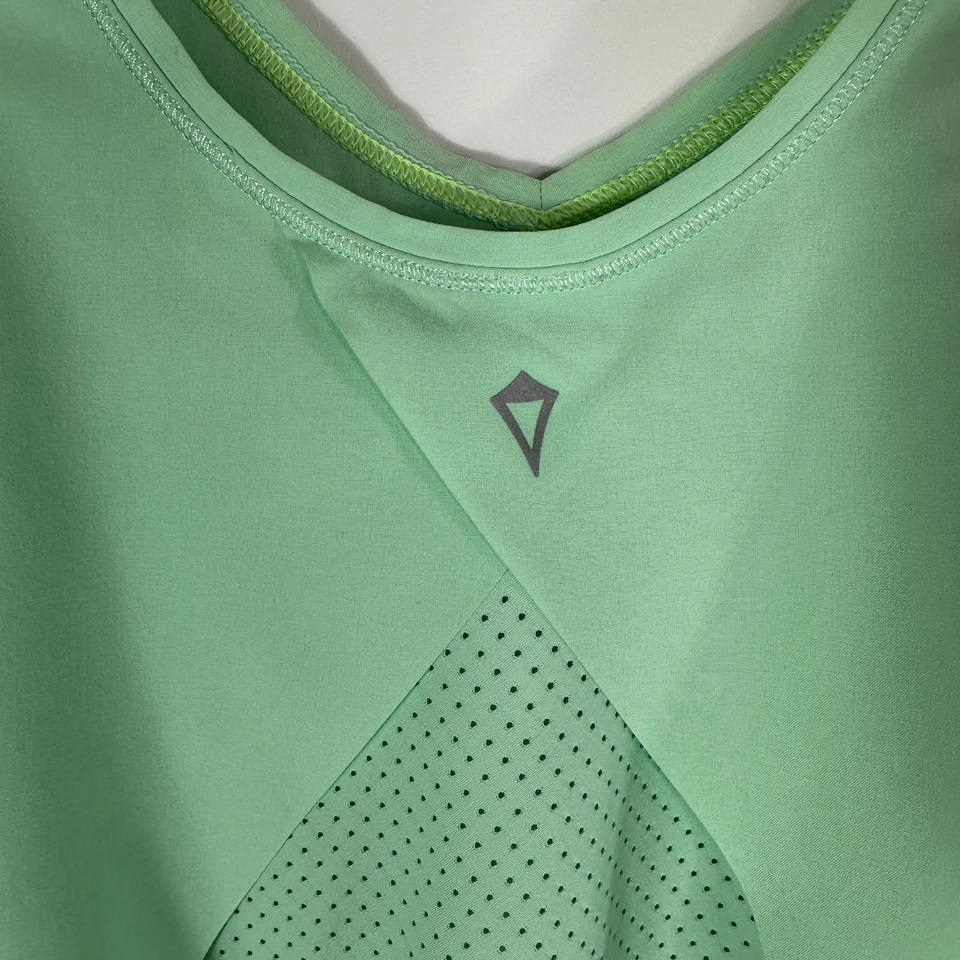 Camiseta sin mangas suelta verde menta Ivivva espalda perforada talla 12? Foto 3 de 4