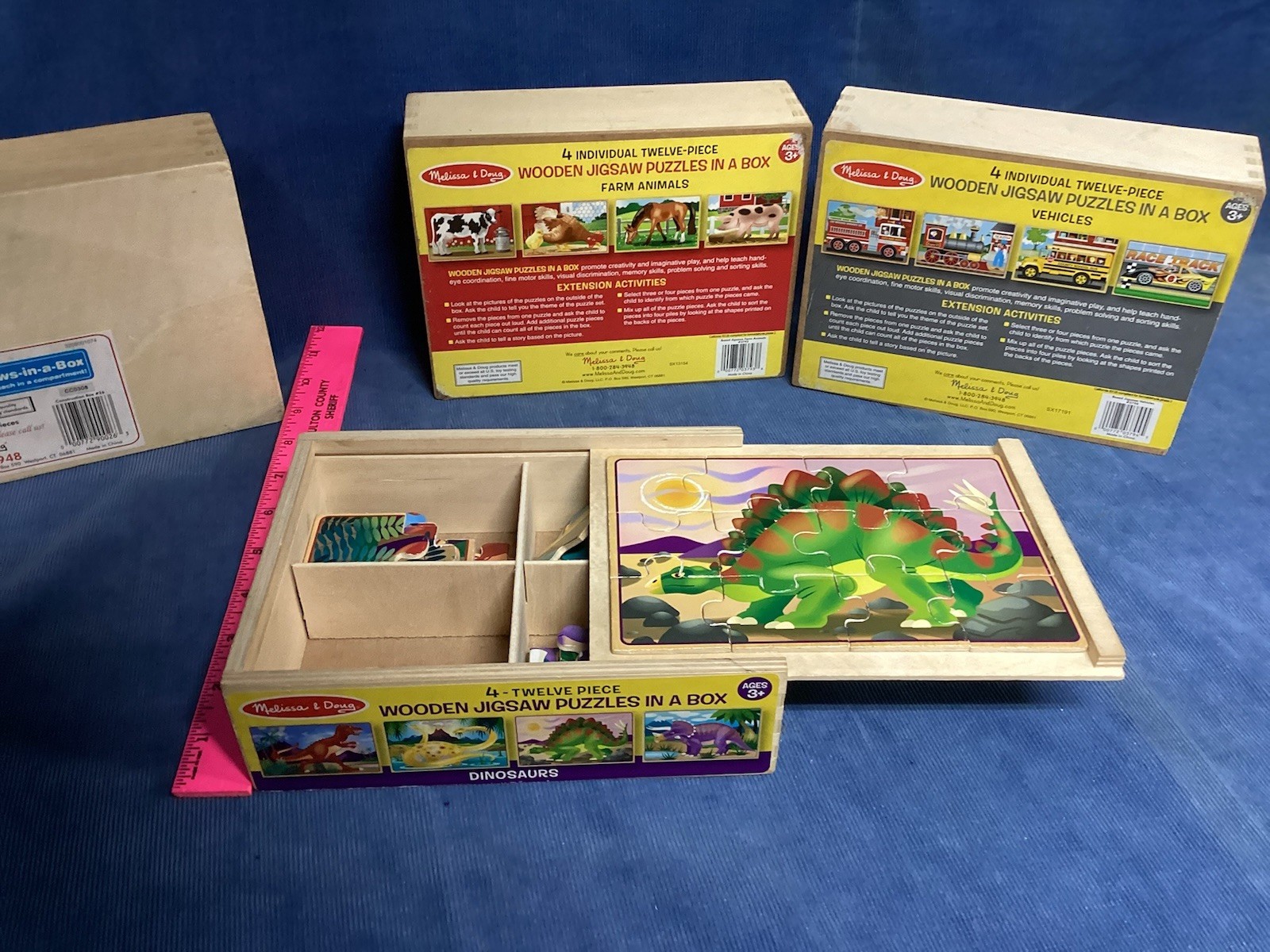 4 Wooden Puzzles in a Box by Melissa and Doug - 4 boxes = 16 puzzles.  Pre owned