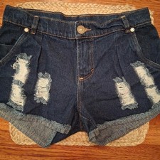 Distressed denim shorts frayed hem pleated front rhinestone button