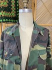 Vintage 1980s USA-made camouflage ranger shirt with green and brown forest pattern and two front flap chest pockets.