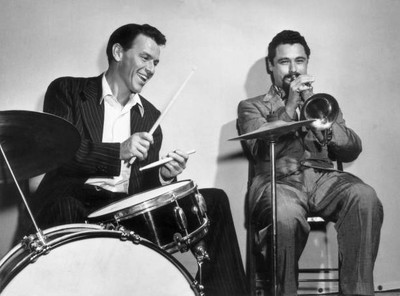 Frank Sinatra plays drums as he sits next American jazz musician S- Old Photo