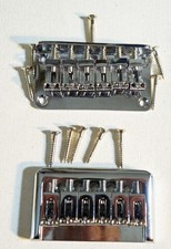 Two Strat style hardtail bridges, string thru and top mount