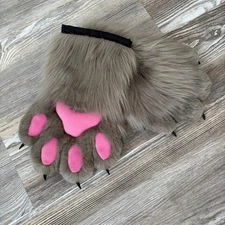 The animal's fluffy brown paws were made by hand. SALE