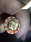 WHEAT PENNY ROLL WITH A UNKNOWN BU WHEAT PENNY SHOWING