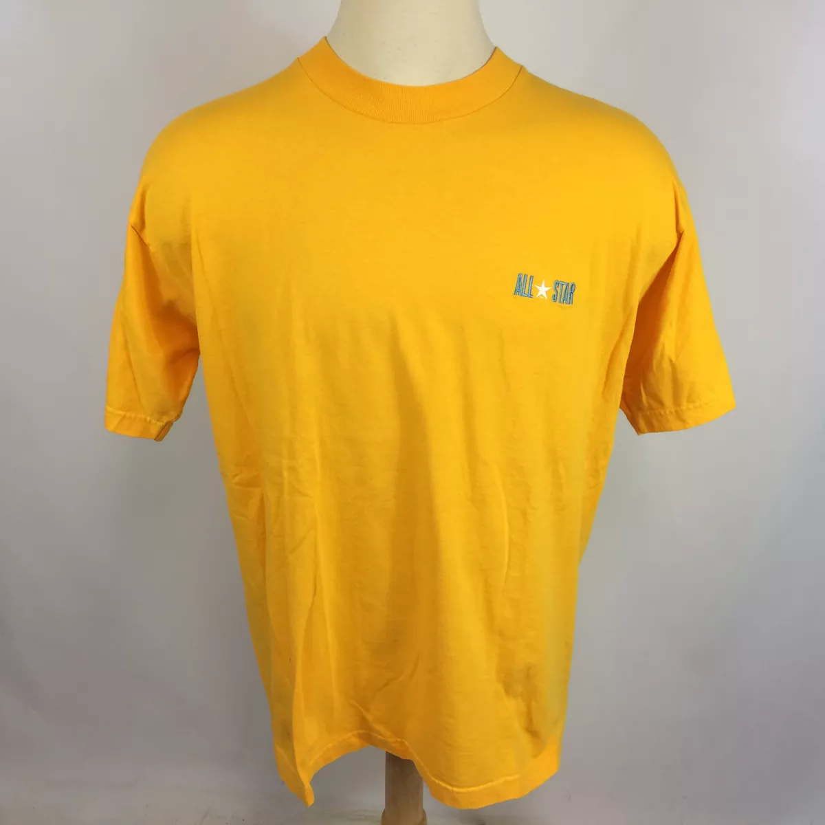 Converse yellow t hot sale shirt