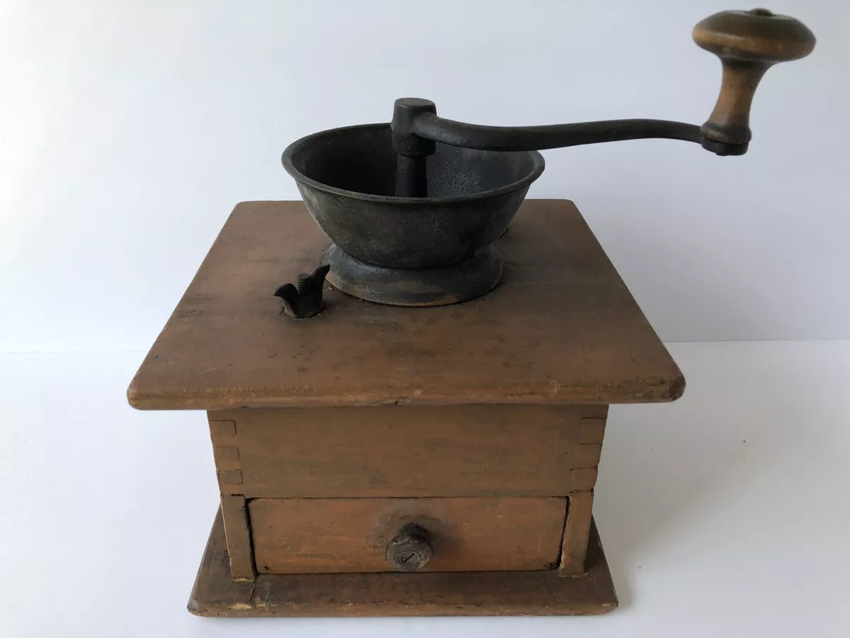 Vintage coffee grinder.Old retro hand-operated wooden and metal