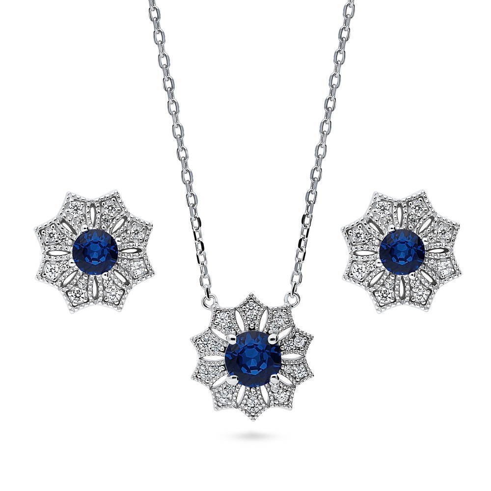 BERRICLE Rhodium Plated Sterling Silver Flower Blue CZ Halo