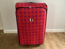 LARGE TRIPP SUITCASE ORANGE WITH PURPLE SPOTS