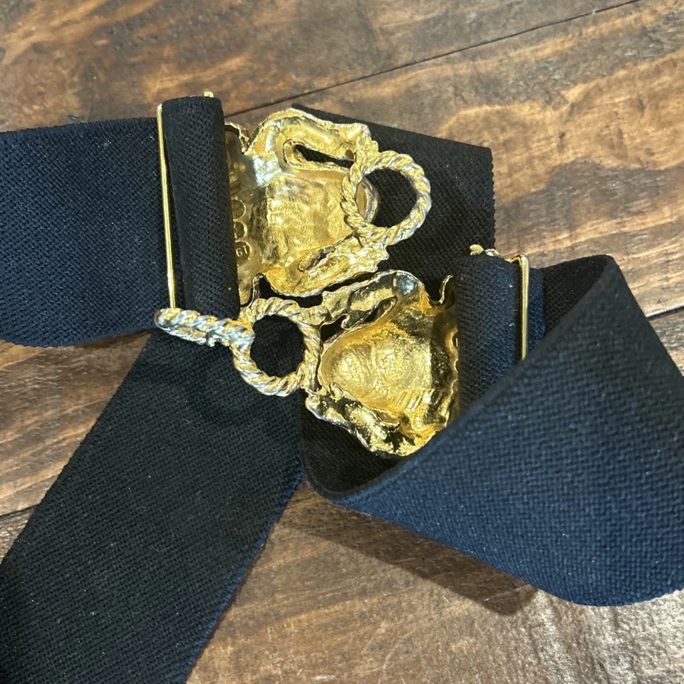 Cinturón con hebilla vintage 1972 Mimi di N marcado doble rana tono dorado negro elástico Foto 2 de 4