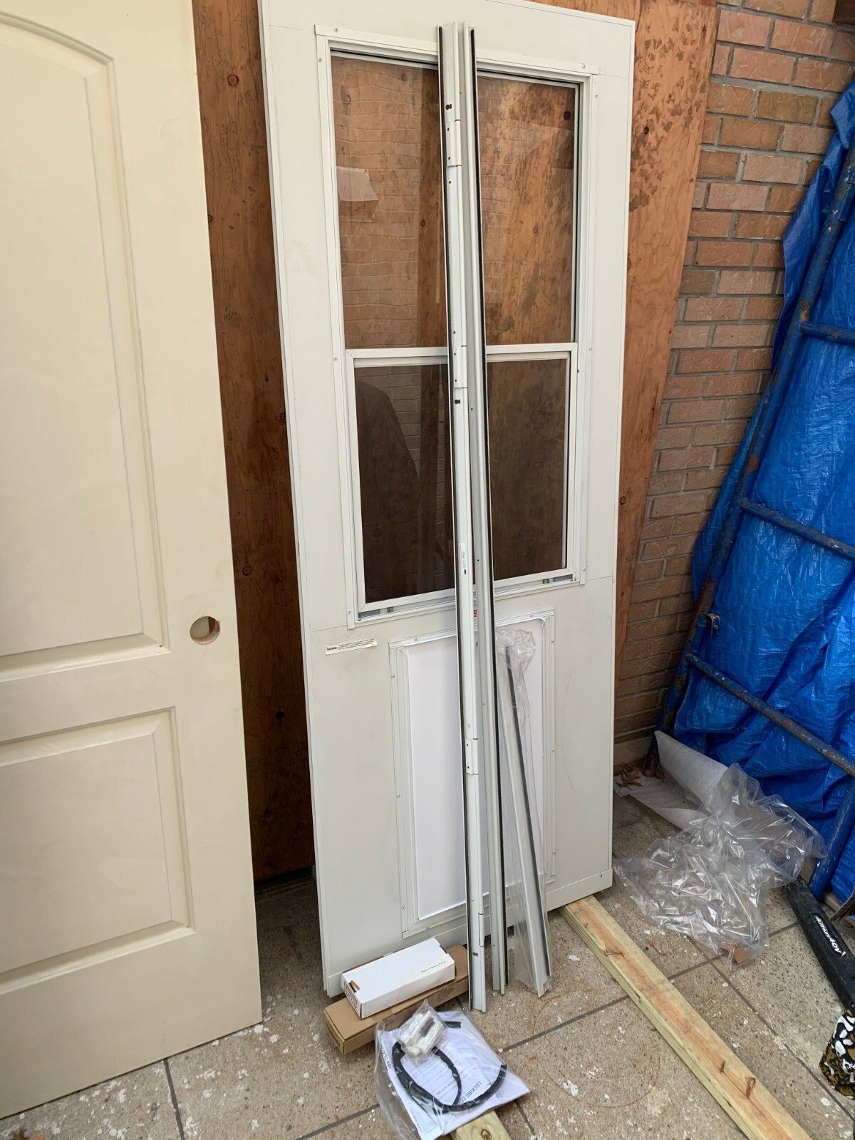 32 inch storm door with pet door