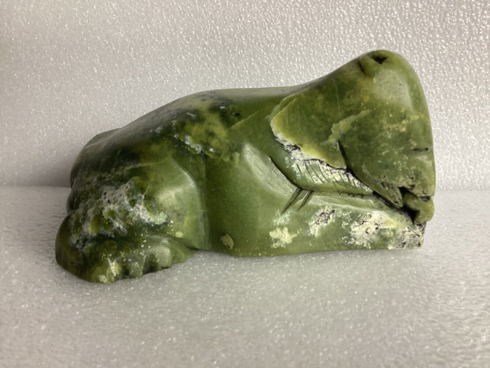 Large Inuit carving of bear eating a fish