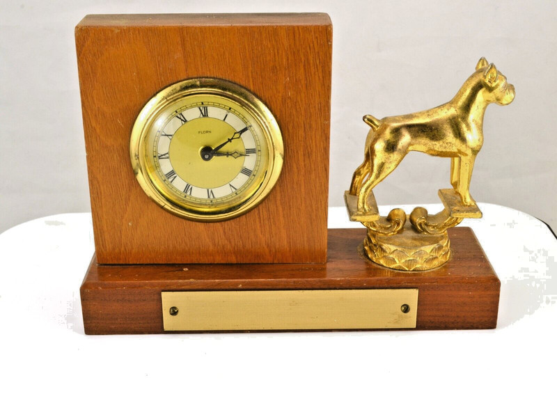 Vintage Gold tone dog trophy with clock on hardwood base.
