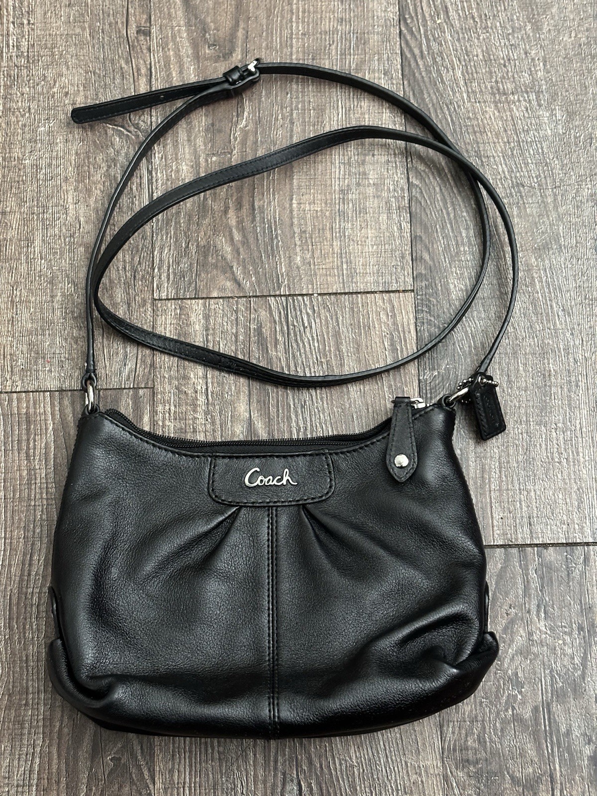 black leather Coach Ashley Swingpack crossbody bag