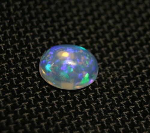 Welo Opal Cabochon 1.81ct Neon Flash Natural Ethiopian Opal See Video 10x8mm - Afbeelding 1 van 4