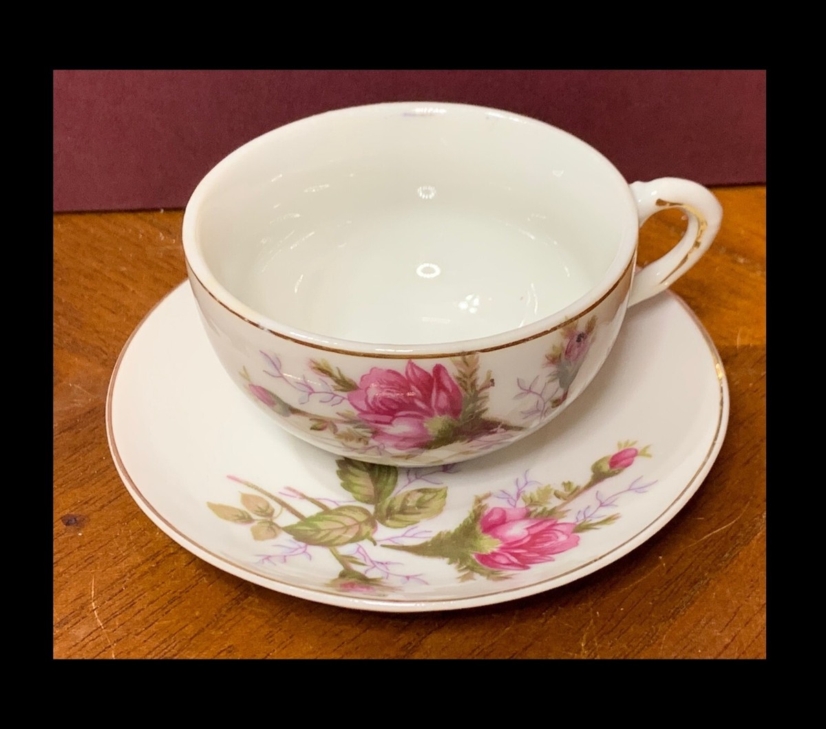 JAP770 VINTAGE CHILD'S CUP AND SAUCER SET WITH ROSES MADE IN