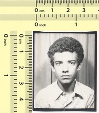 Teenager With Curly Hair – Serious Expression – 1970s Photo booth original