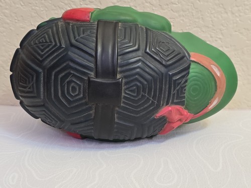 Black and green Teenage Mutant Ninja Turtles football Raphael with textured silver and red sole.