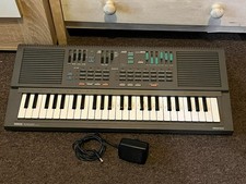 Yamaha Portasound PSS-460 Electronic Keyboard FM Synthesizer with Power Supply.