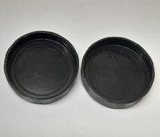 A pair of clean 39mm back occular dust lens cap covers for binoculars